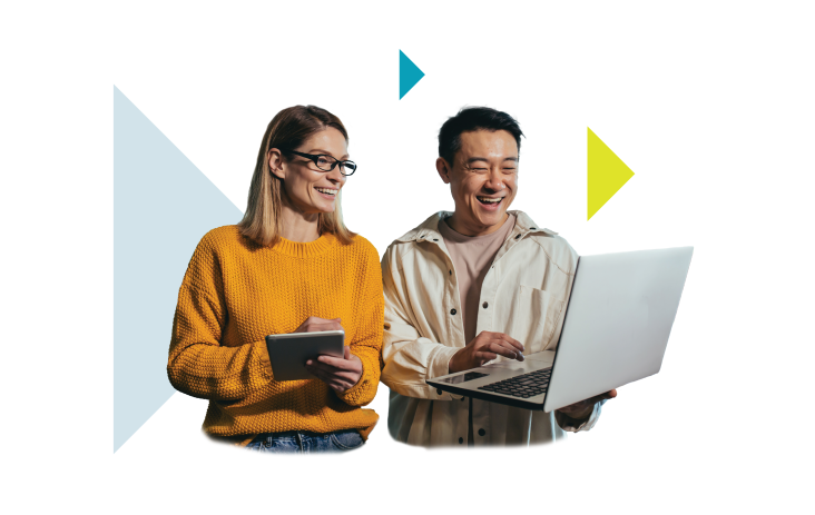 A man and a woman stand holding a laptop and a tablet.