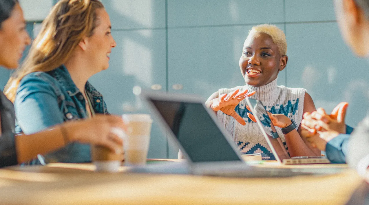 Business women smiling at a table