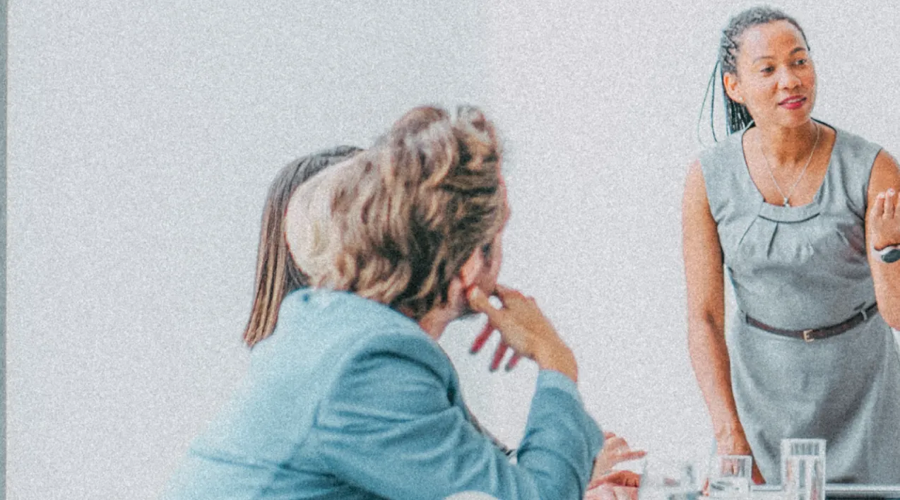 Woman talking to group of people